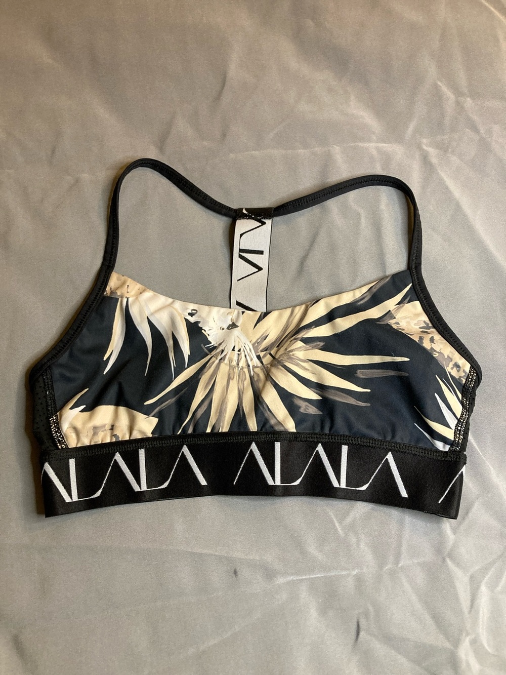 Alala Black & Cream Tropical-Leaf Sports Bra